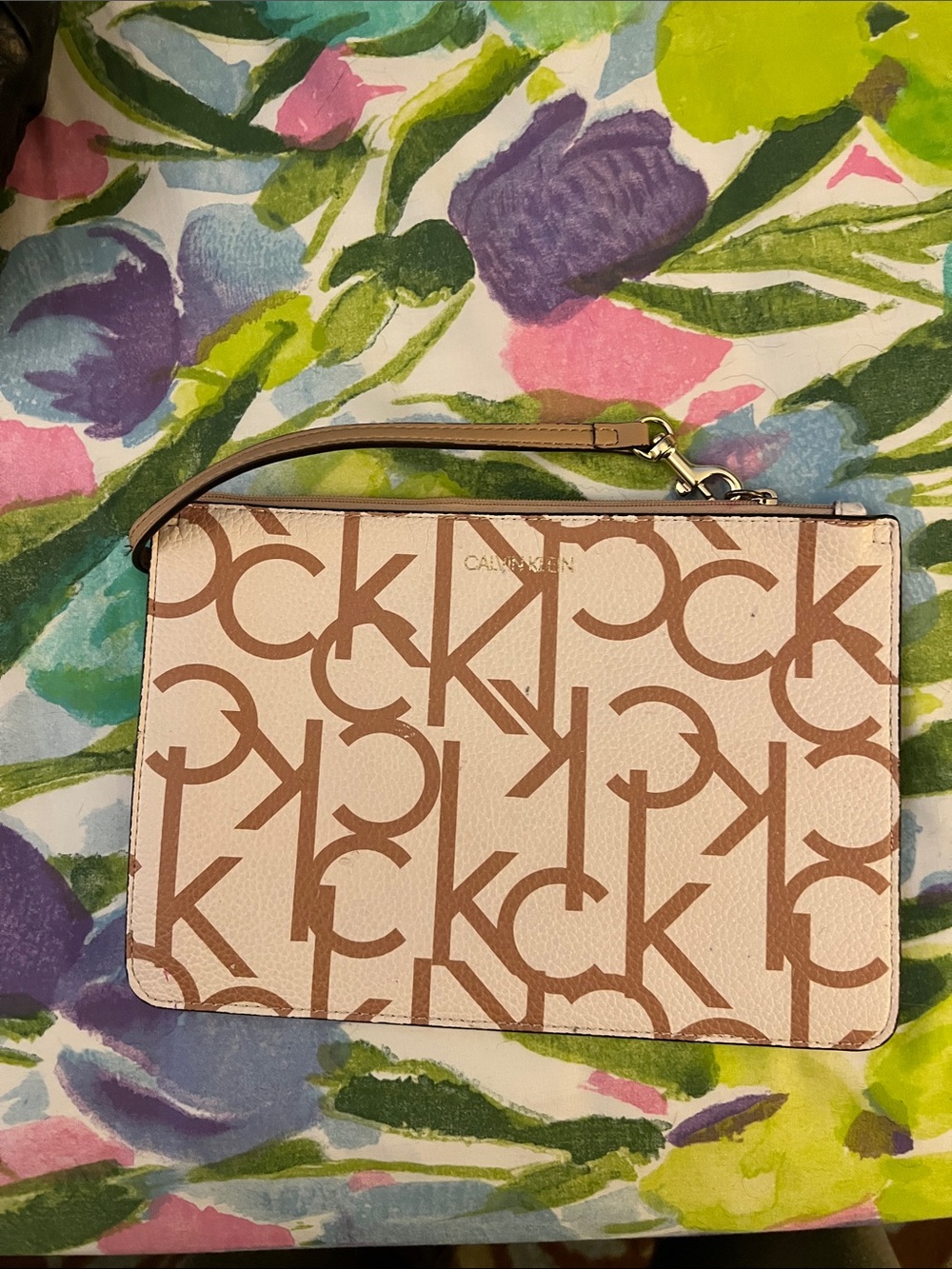 Calvin Klein Logo Wristlet in gold and Tan